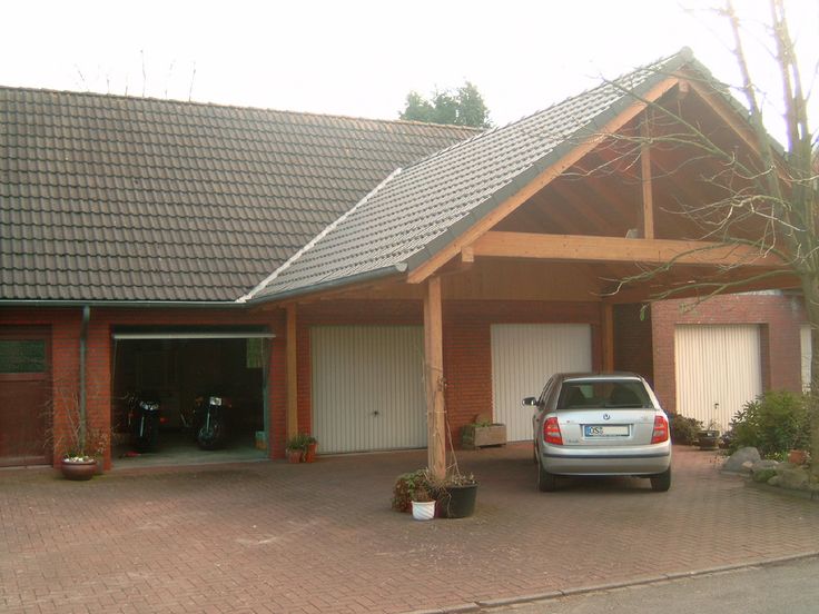 Attached carport with timber posts and a beam over the driveway