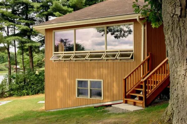 New room built onto the back of a house with a large picture window