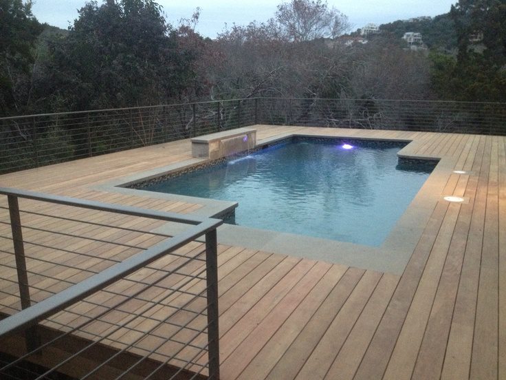 Wood pool deck with a cable railing