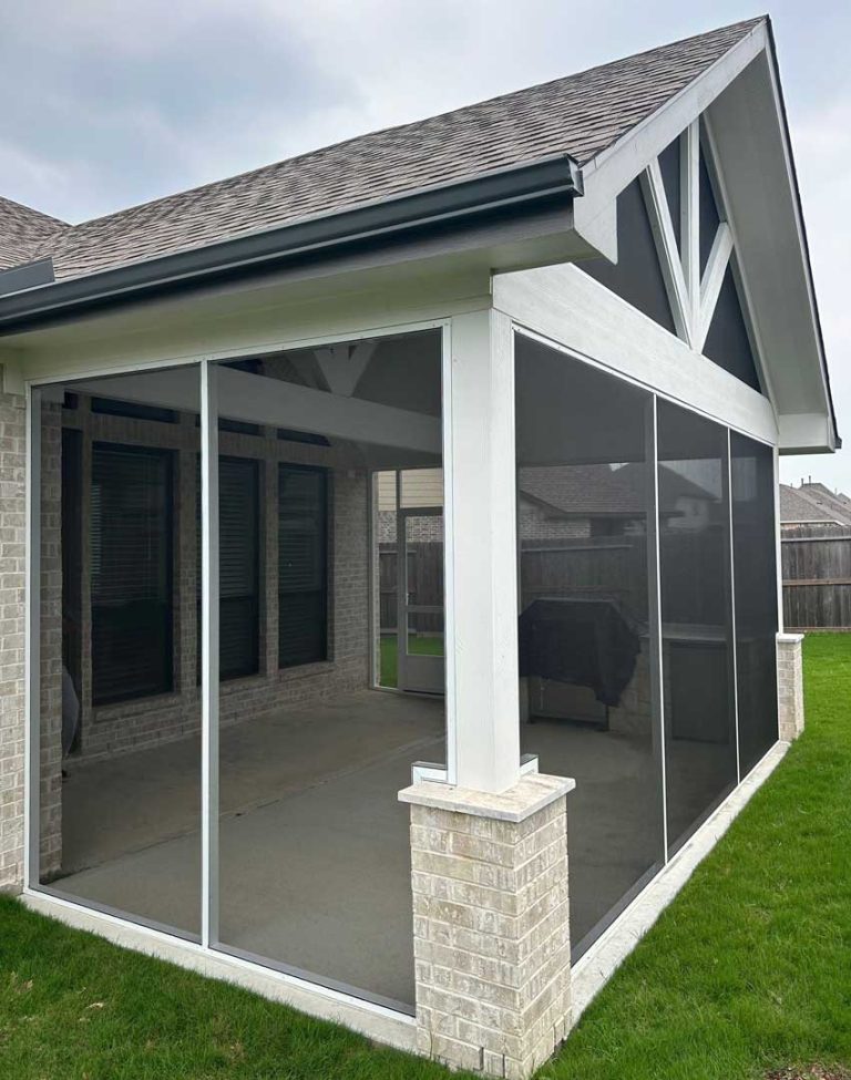 Screened porch with white framing on a stone column base