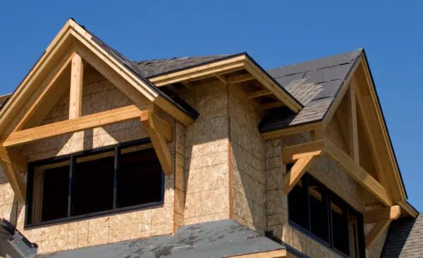 Two new gables framed and sheathed on a room addition