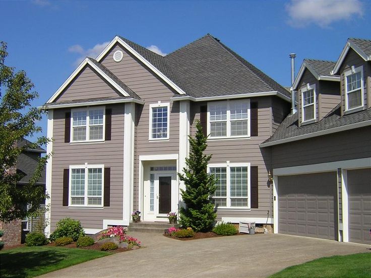 Freshly painted exterior of a Houston home with clean siding and trim