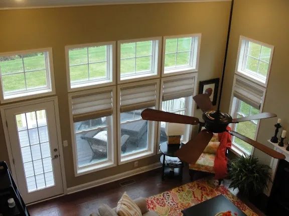 Two story living room with a tall wall of grid windows