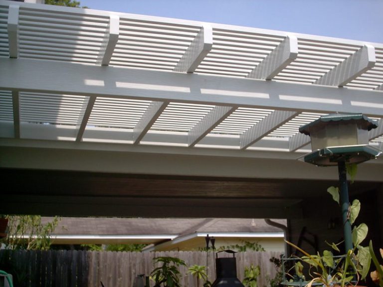 Close-up of a white pergola roof with open slats