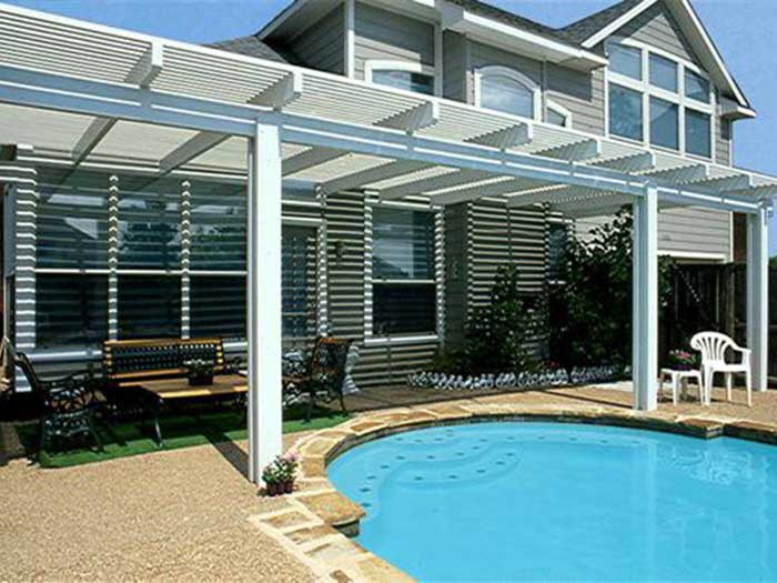 Wood pergola shading an outdoor seating area